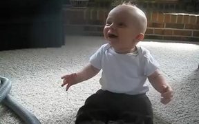 Baby Laughing At The Vacuum
