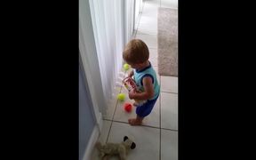 Toddler Struggles To Pick Up Balls - Kids - VIDEOTIME.COM