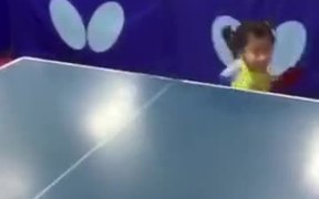 Little Girl Playing Table Tennis Like A Pro