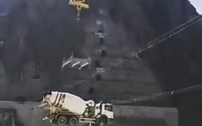 Truck Being Carried Over By Rescue Team