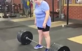 An Old Woman Lifts A 220 Lb Weight