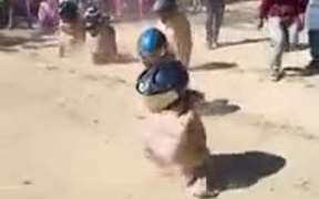 The Sack Racing With Helmets