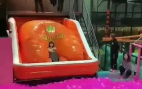 A Girl Diving Inside Balls