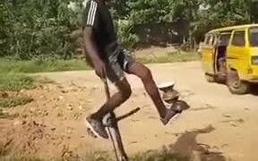 Boy Performing Impossible Unicycle Trick