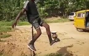 Boy Performing Impossible Unicycle Trick