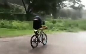 Australian Guy Riding A Bike In The Rain
