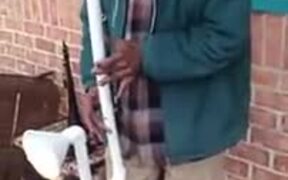 Man Playing Water Pipe Saxophone