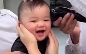 Giggling Baby Getting A Haircut
