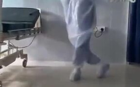 A Doctor Dancing In A PPE Kit