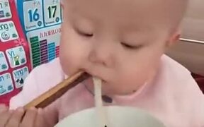 A Toddler With Fine Chopstick Skill