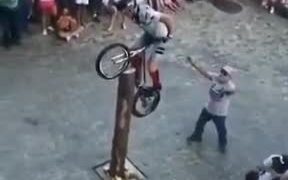 Cyclist Climbing A Pole On A Cycle - Sports - VIDEOTIME.COM