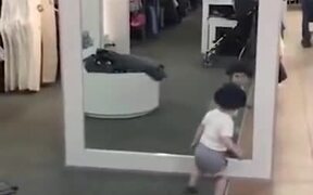 Baby Trying To Figure Out How A Mirror Work