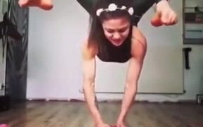 Girl Performing Gymnastics On A Ball