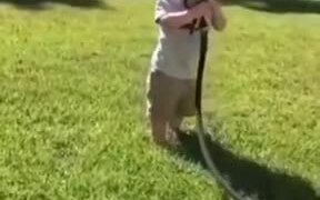 Little Boy Learned Of Garden Hose