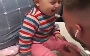 Baby Boy Plays With His Father