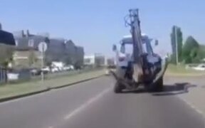 Excavator On Road Loses Rear Wheel