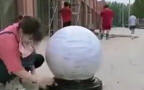 Cool Painting On A Sidewalk Stone Sphere - Fun - VIDEOTIME.COM