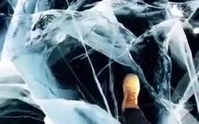 Staring Into The Deep Abyss Of A Frozen Lake - Fun - VIDEOTIME.COM