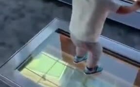 Toddler Freezes While Standing On A Glass