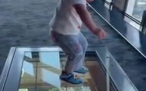 Toddler Freezes While Standing On A Glass