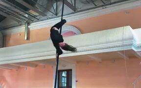 Woman Performs Mind-Blowing Tricks on Aerial Pole
