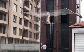 Guy Speedily Climbs Tall Building