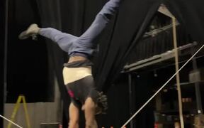 Guy Performs Walking Handstand On Slackline