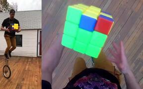 Person Solves Giant Rubik's Cube On Unicycle - Fun - VIDEOTIME.COM