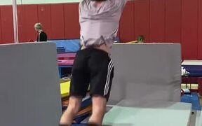 Athlete Performs 360 Spins on High Bar in Gym - Sports - VIDEOTIME.COM