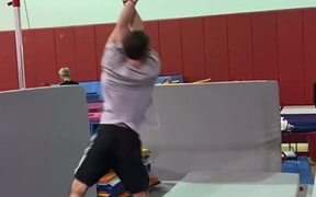 Athlete Performs 360 Spins on High Bar in Gym - Sports - VIDEOTIME.COM