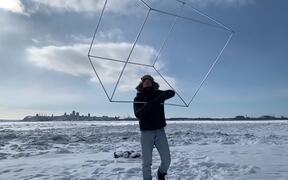 Guy Juggling With Giant Hollow Cube