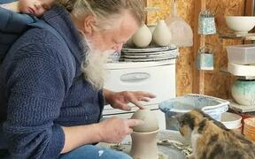 Cat Plays With Pottery Wheel