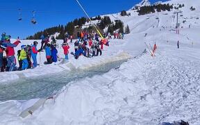 Downhill Skiers Glide on Water