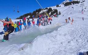Downhill Skiers Glide on Water