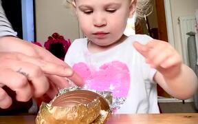 Little Girl Waits for Chocolate Easter Egg
