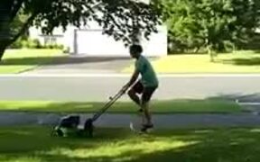 Guy Mows Lawn While Riding Unicycle