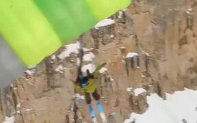 Guy Jumps Off Cliff & Opens Parachute While Skiing