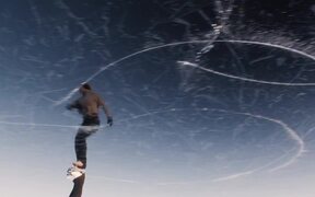 Figure Skater Performs on Frozen Lake - Sports - VIDEOTIME.COM