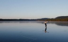Figure Skater Performs on Frozen Lake - Sports - VIDEOTIME.COM