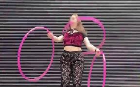 Girl Executes Impressive Tricks With Hoops
