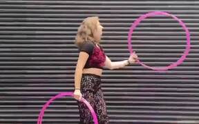 Girl Executes Impressive Tricks With Hoops