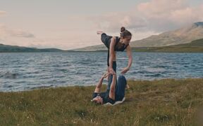 Acroyoga Duo Performed Advanced Flow by a Lakeside - Sports - VIDEOTIME.COM