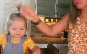 Toddler Assists Mom In Baking Cake