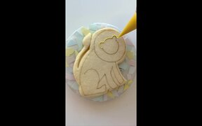 Person Decorates Lion Shaped Cookie - Fun - VIDEOTIME.COM