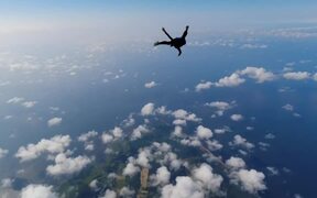 Skydiver Performs Different Poses in Sky - Fun - VIDEOTIME.COM