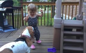 Toddler And Dog Dancing On Deck