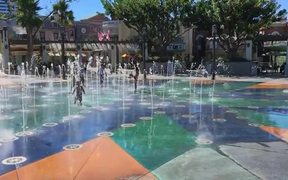 Kids Playing in Water Fountain Slow-motion