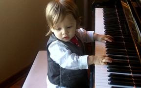 Cute Baby Boy Is Playing The Piano