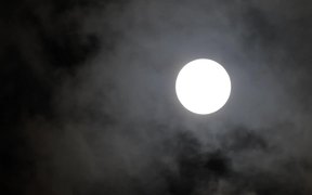 Clouds Over Full Moon at Night