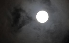 Clouds Over Full Moon at Night